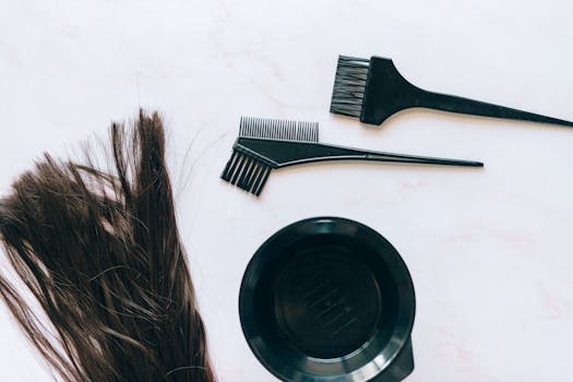 pexels-photo-8468142-8468142-1 Top view of hair coloring tools and hair strands on a white background.