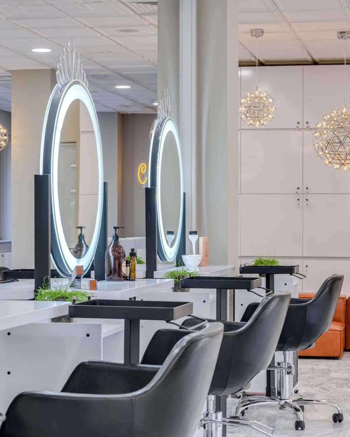 Bright, modern hair salon interior with styling chairs